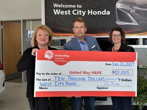 Greg Sudds, President & G.M. of West City Honda presents a cheque to Kathy Murphy and Melanie Cressman of United Way HPE.