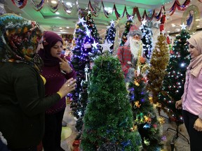 SABAH ARAR/Getty Images
Iraqis shop for Christmas paraphernalia in the capital Baghdad on Dec. 16.