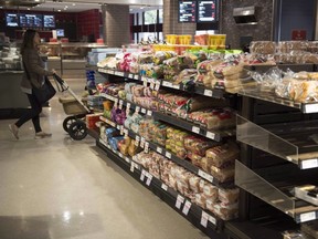 Various brands of bread sit on shelves in a grocery store in Toronto on Wednesday Nov. 1, 2017. (THE CANADIAN PRESS/Doug Ives)