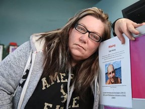 Sherri Lockman, seen in this December file photo with a poster for her missing son Tyler, has some closure now that his body was found but still has many questions about how he ended up in the Hanmer area and what led to his death. (Gino Donato/The Sudbury Star)