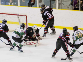 Sarnia Legionnaires defenceman Alec Trusler (No. 2 in black) battles with a St. Thomas Stars forward behind the Sarnia net during Thursday's Jr. 'B' hockey contest. Trusler, who scored a clutch goal, helped his team defeat St. Thomas 5-2. Photo courtesy of Shawna Lavoie.