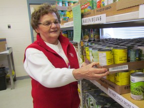 Volunteer Rita Price is shown in this file photo in the food bank at the Salvation Army in Sarnia. This year's Kettle campaign in aid of the food bank and Salvation Army family services ends Saturday. (File photo)