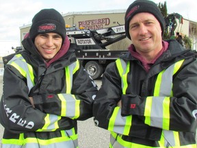Gary Vandenheuvel, right, owner of Preferred Towing, and his son, Collin Vandenheuvel, are part of the cast of the Discovery reality show Heavy Rescue: 401. (File photo)