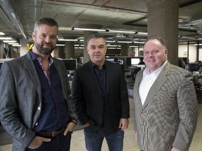 John D?Orsay, left, Jason Parker and Serge Babenko in the new Talbot Street offices of RoomRoster. Parker is the founder and president of the software company, which helps people organize sporting events and lodging. (MIKE HENSEN, The London Free Press)