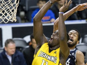 London Lightning forward Bryan Akinkgube blows past Niagara River Lion Marvell Waithe to score in a National Basketball League of Canada game Friday at Budweiser Gardens. The Lightning won 118-109. (DEREK RUTTAN, The London Free Press)