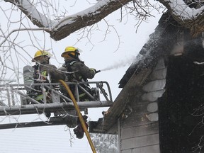 Chatham firefighters were called to a house fire at 115 West St. in Chatham, Ont. on Saturday December 23, 2017. Chatham-Kent Fire & Emergency Services reports a female was taken to hospital with smoke inhalation. Ellwood Shreve/Chatham Daily News/Postmedia Network