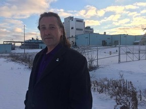 Woodstock Mayor Trevor Birtch is shown near the moribund Firestone textile factory in his city, which will begin closing in stages Jan. 1, ending an 80-year company run in Woodstock. Heather Rivers/Woodstock Sentinel-Review/Postmedia News