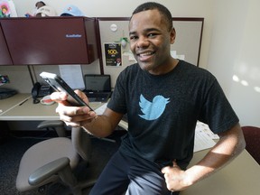 London city councillor Mo Salih uses his twitter account from his office at London City Hall. (MORRIS LAMONT, The London Free Press)
