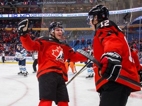 Canada's Boris Katchouk celebrates his goal with teammate Tyler Steenbergen, left, during the first period of IIHF World Junior Championship preliminary round hockey action against Finland, in Buffalo, N.Y., on Tuesday. (THE CANADIAN PRESS)