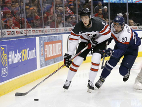 Slovakia's Adam Ruzicka, right, of the Sarnia Sting chases Canada's Philippe Myers during a preliminary-round game at the 2017 world junior hockey championship in Toronto on Tuesday, Dec. 27, 2016. (MICHAEL PEAKE/Postmedia Network)