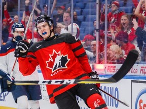 Canada?s Sam Steel celebrates after scoring on Slovakia goalie David Hrenak during the first period of their preliminary round game at the world junior championship in Buffalo on Wednesday night.  (The Canadian Press)