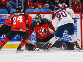 Colton Point guards the net against Slovakia's Peter Kundrik as Canada's Alex Formenton follows during the first period of IIHF World Junior Championship preliminary round hockey action in Buffalo, N.Y. Wednesday.
Mark Blinch / The Canadian Press