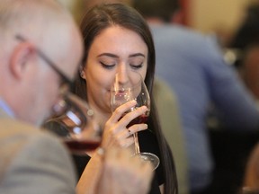 The first pinot noir is blind-taste-tested at The Judgement of Kingston 2017 at the Residence Inn Kingston Water's Edge in Kingston, Ont. on Saturday November 4, 2017. At the end of the tasting, guests were invited to vote on whether the wine was from Prince Edward County or from France. Steph Crosier/Kingston Whig-Standard/Postmedia Network