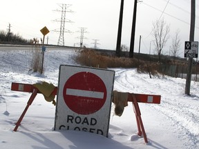 Signs deter travellers from using a path northwest of the Sun curve bridge. The City of Sarnia is in talks with CSX Corporation, hoping to create a safe crossing over CSX rail lines. (Tyler Kula/Sarnia Observer)