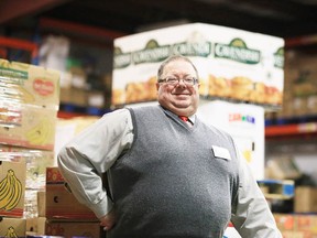 Dan Xilon, executive director of the Sudbury Food Bank, stands in the packed warehouse on Dec. 18. (Gino Donato/Sudbury Star)