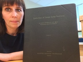This is a photo of Janice Martell, of the McIntyre Powder Project, taken at the Archives of Ontario. The resource book was compiled by the McIntyre Research Foundation and contains photos of lung sections of deceased former mine employees.  “It is appalling when you actually hold this book in your hands and consider its contents,” Martell told The Daily Press.  “It appears that the Ontario government (Department of Health) was significantly involved.  I have no idea if there was any consent obtained by each miner or his family prior to including his body tissue in this book. These workers were talked about in the book like lab specimens.”