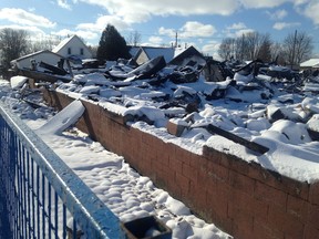 The aftermath of a large fire to the Tom and Al's Quality Furnishings warehouse on King Street. The Dec. 23 fire also caused damage to three homes directly behind the warehouse on Queen Street. Police have begun an arson investigation.