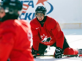 Canada's Jordan Kyrou of the Sarnia Sting stretches on the ice during an outdoor practice at New Era Field during the IIHF World Junior Championship in Orchard Park, N.Y., on Thursday, Dec. 28, 2017. (MARK BLINCH/The Canadian Press)