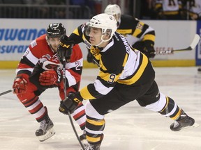 Kingston Frontenacs forward Nathan Dunkley fires a shot toward the Ottawa 67’s goal during the second period of their Ontario Hockey League game at the Rogers K-Rock Centre on Thursday. (Elliot Ferguson/The Whig-Standard)