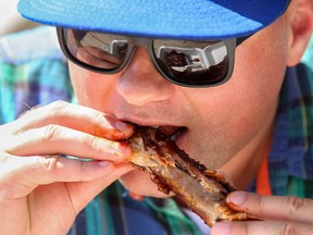 Tim Miller/Intelligencer File Photo
Craig Jenkins of Trenton enjoys a rack of juicy ribs at Quinte Ribfest at Trenton’s Centennial Park on Saturday August 12, 2017.