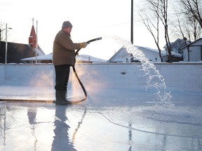 Steven Lamore, president of Antwerp Playground, floods the outdoor rink in Sudbury, Ont., on Friday, December 29, 2017. Saturday's forecast calls for a high of -19C and -37 with the wind chill with a 60 per cent chance of flurries. Gino Donato/Sudbury Star/Postmedia Network