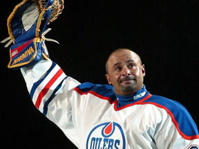 Grant Fuhr waves to fans at Skyreach Centre Oct. 9, 2003, during a ceremony commemorating his years as goalie with the Edmonton Oilers. - file photo