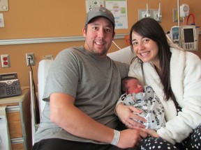 Murphy Pereira, Sarnia's New Year's baby, naps in the arms of his parents Mathew and Courtney Pereira. Murphy was born at 12:30 a.m. on New Year's Day at Bluewater Health.
Paul Morden/Sarnia Observer/Postmedia Network