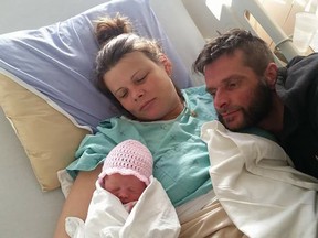 Mom Pamela Blacklock and dad Ron Lafrance look on as baby Winter Rose sleeps, just a few hours after her arrival on a frigid Jan. 1. (supplied photo)