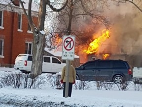 Two people and a cat were able to escape from a Jan. 1 house fire on Oak Street in Aylmer. The blaze destroyed the home and a vehicle with an attached trailer. (Contributed Photo)