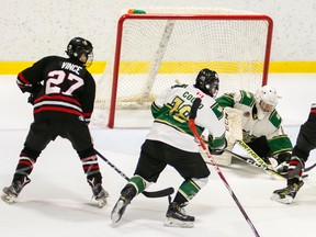 Jake Vince, No. 27 in black, and Joey Zappa (No. 19) storm the net during the last home game of the Sarnia Legionnaires before the Christmas break. The Jr. 'B' hockey club returns to action Thursday when it hosts the first-place London Nationals. Photo courtesy of Shawna Lavoie. (Handout/The Observer)