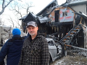 John Friesen stands in front of his and his wife's west-Aylmer house, which was engulfed in flames on New Year's Day. Now the long-time Aylmer couple is getting help from people around the community, many eager to support them through their recovery. (Louis Pin // Times-Journal)