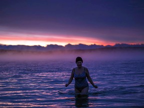 Rebecca Mende enjoys a sunrise swim in the North Channel before things got really cold. Peter Baumgarten/Creative Island Photography