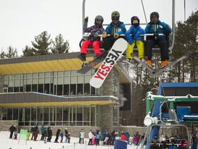 The lineup moves quickly at Boler Mountain in London as its main quad lift transports hundreds of skiers and snowboarders to the top of their hill. Boler has had a banner start to the season with a fresh $6-million chalet keeping people on the property longer and in comfort. (Mike Hensen/The London Free Press)