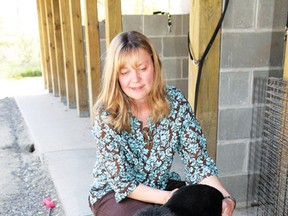 Jill Pessot, of Pet Save in Lively, with Tommy the dog. (John Lappa/Sudbury Star file photo)