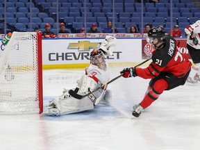 Canada’s Brett Howden fires the puck over Switzerland goalie Philip Wýthrich for the opening goal just 48 seconds into the first period of the world junior hockey championship quarterfinal at the QeyBank Center in Buffalo on Tuesday. Canada was up 3-0 by the end of the first period and cruised to an 8-2 win to set up a semifinal against the Czech Republic on Thursday. (Getty images)