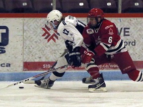 Woodstock Navy Vets Justin Vandendool, left, carries the puck with Norwich Merchants Dan Gallagher pursuing him at Southwood arena in Woodstock, Ont. on Tuesday January 2, 2018. The Vets won 5-4. Greg Colgan/Woodstock Sentinel-Review/Postmedia Network