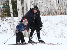 Josh Lahnalampi, 6, and his dad, Clinton, ski the trails at Kivi Park in Sudbury, Ont. on Tuesday January 2, 2018. John Lappa/Sudbury Star/Postmedia Network