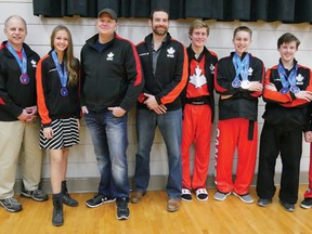 Martial Arts Canada's contingent at the WKC Worlds in Orlando, Florida, in November included from left, Sensei Greg Rockefeller, Sensei Mike Hill, Kenzie Kilmer, Cody Martyn, Sensei Patrick Grigg, Kristian VanLeeuwen, Logan Brown, Ewan Lindsay and Ian Cross. (Chris Abbott/Tillsonburg News)