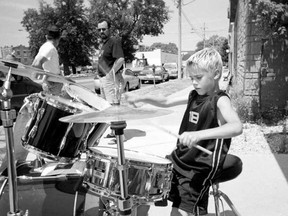 At age eight, a young Justin Bieber demonstrates his drumming skills on the streets of Stratford in this Beacon Herald file photo from July 2002. This photo, along with many others, will be on display at the Stratford Perth Museum as part of its Bieber exhibit, opening on Feb. 18. (File photo/The Beacon Herald/Postmedia Network)