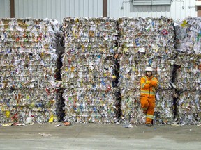 Andrew Robertson, a team leader at Miller Waste Systems, stands among baled recyclables at the company?s London plant. There?s uncertainty where this stuff will go in the future because China, the largest importer of North America?s recyclables, has clamped down on what it takes, warning it won?t be the world?s garbage dump any longer. (DEREK RUTTAN, The London Free Press)