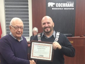 Raymond Fortier accepts the December Volunteer of the Month award for his volunteer contributions to the community.