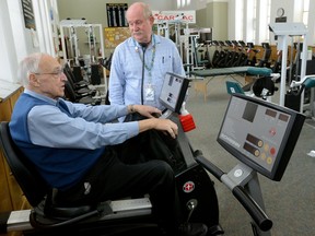 Dr. Larry Patrick, right, talks with patient Bill Brady at the Cardiac Fitness Institute at the London Health Sciences Centre on Wednesday January 3, 2018. (MORRIS LAMONT, The London Free Press)