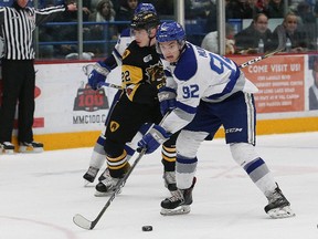 Blake Murray, right, of the Sudbury Wolves, skates past Jack Hanley, of the Hamilton Bulldogs, during OHL action at the Sudbury Community Arena in Sudbury, Ont. on Friday December 15, 2017. John Lappa/Sudbury Star/Postmedia Network