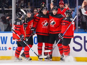 Canada's Jonah Gadjovich, second right, celebrates his goal with teammates Michael McLeod, centre, Cale Makar, right, Tyler Steenbergen, second left, and Victor Mete against Slovakia during the second period of IIHF World Junior Championship preliminary round hockey action in Buffalo, N.Y. Wednesday December 27, 2017. THE CANADIAN PRESS