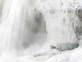Ice coats the rocks and observation deck at the base of the Horseshoe falls in Niagara Falls, Ontario on January 3, 2018. The cold snap which has gripped much of Canada and the United States has nearly frozen over the American side of the falls.(Getty Images)