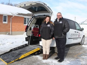 Laura Domingos, community support services supervisor with Lambton Elderly Outreach, stands with agency CEO Bill Yurchuk and its new non-urgent stretcher van at LEO's Reece's Corners office Thursday. LEO purchased the van, hoping to demonstrate viability and get government funding for more. (Tyler Kula/ The Observer)