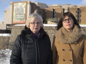 London MPP's Peggy Sattler and Teresa Armstrong stand in front of the Victoria Campus of the London Health Sciences Centre. (MIKE HENSEN, The London Free Press)