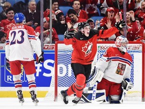 Canada forward Drake Batherson (19) celebrates his goal on Czech Republic goaltender Josef Korenar (30) as Czech Republic defenceman Jakub Galvas (23) looks on during second period semifinal IIHF World Junior Championship hockey action in Buffalo, N.Y. on Thursday.
Nathan Denette /The Canadian Press