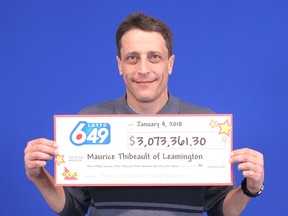 Maurice Thibeault holds up a cheque for $3,073,361.30 – precisely half of the approximately $6-million win from the Sept. 20 lottery draw. Thibeault, who now lives in Leamington, has been in a four-month dispute with his ex-common-law girlfriend Denise Robertson of Chatham over the winnings.