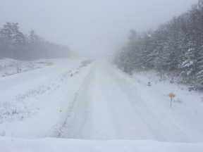 Hwy. 402 just west of London remained closed Friday afternoon, some 24 hours after police shut it down to traffic amid heavy snowfall. This photo was taken from the Oriole Drive overpass. (Mike Hensen/The London Free Press)